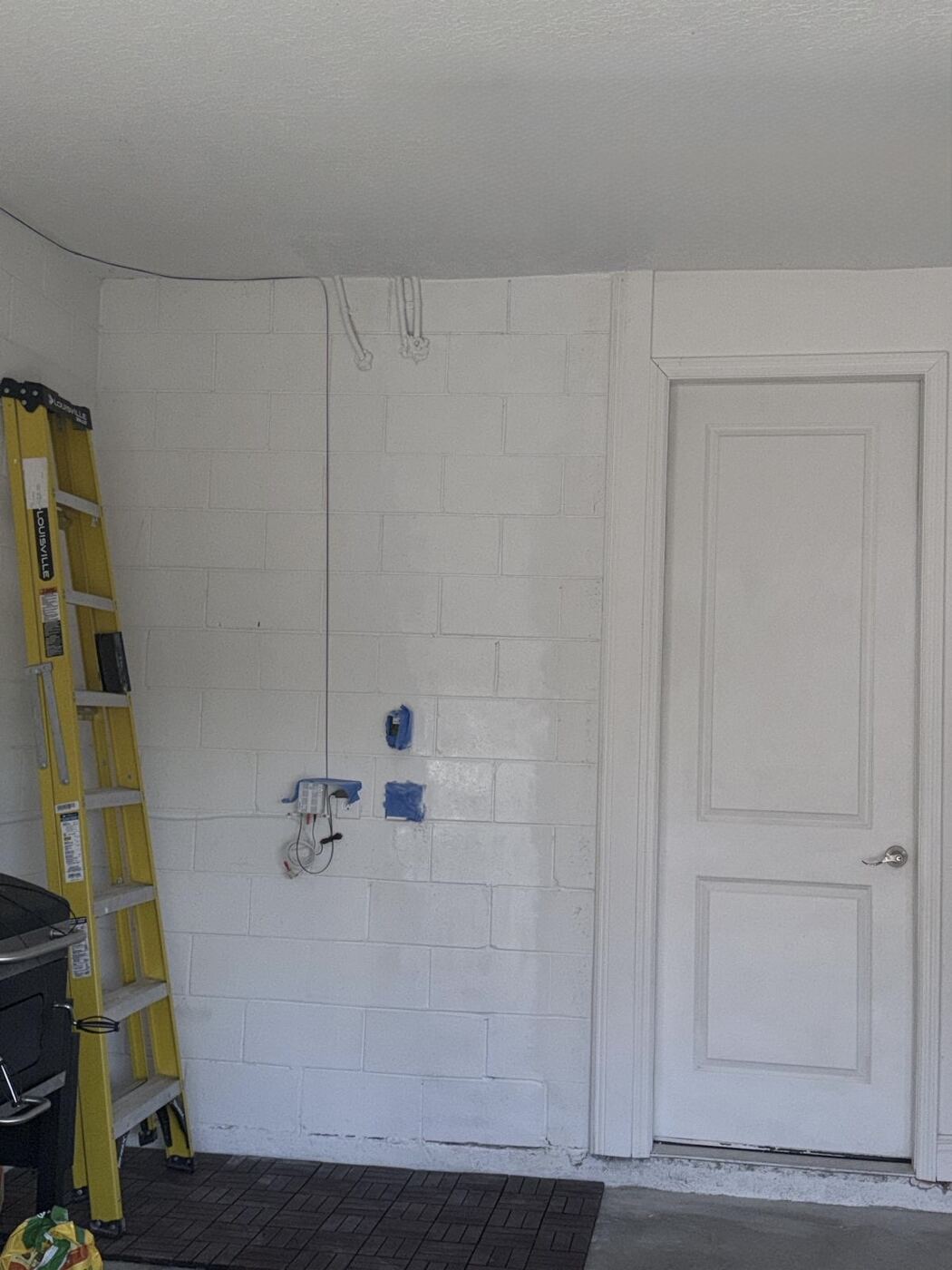 Garage wall repainted after repair, no water damage